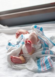 Newborn baby feet in hospital room