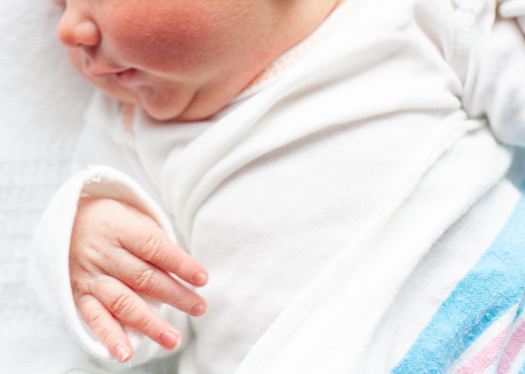 Newborn baby hands in hospital