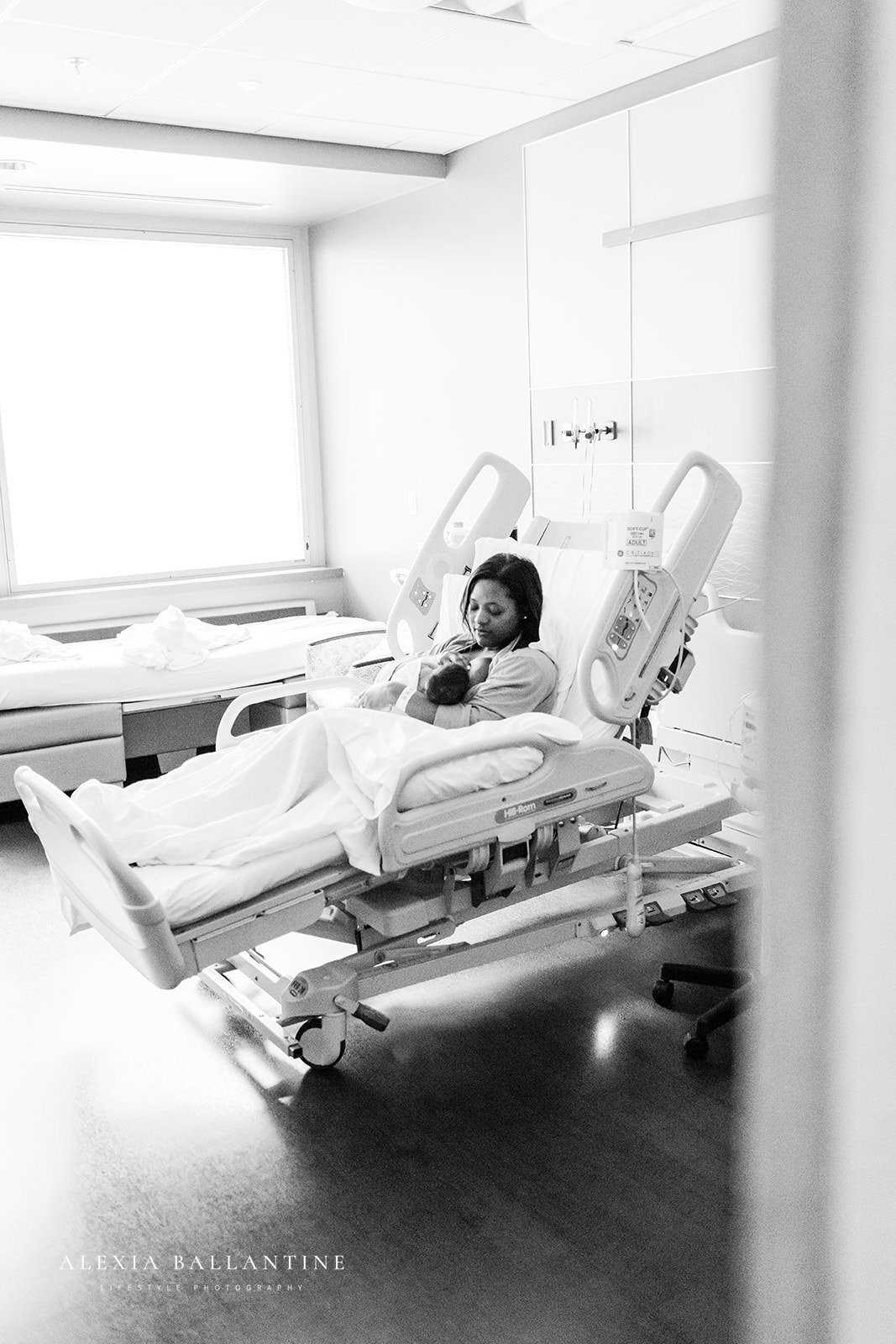 Mother and baby in hospital bed