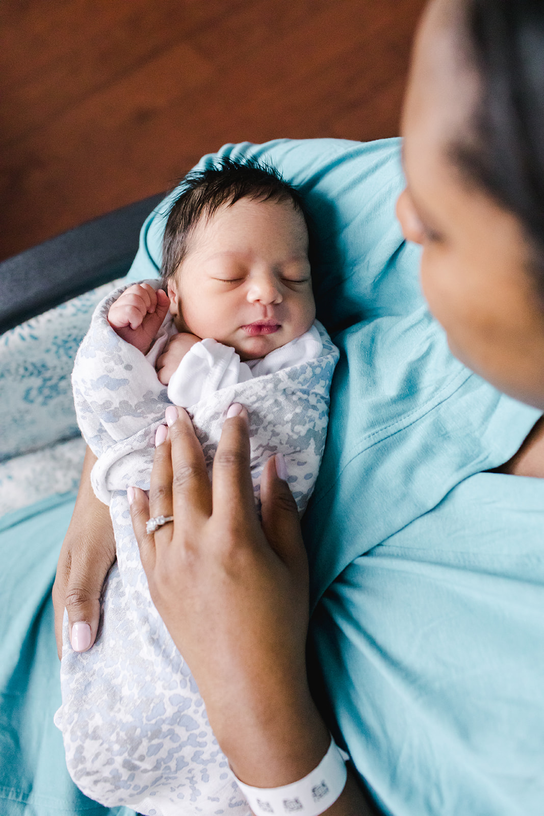 Newborn baby held by mother