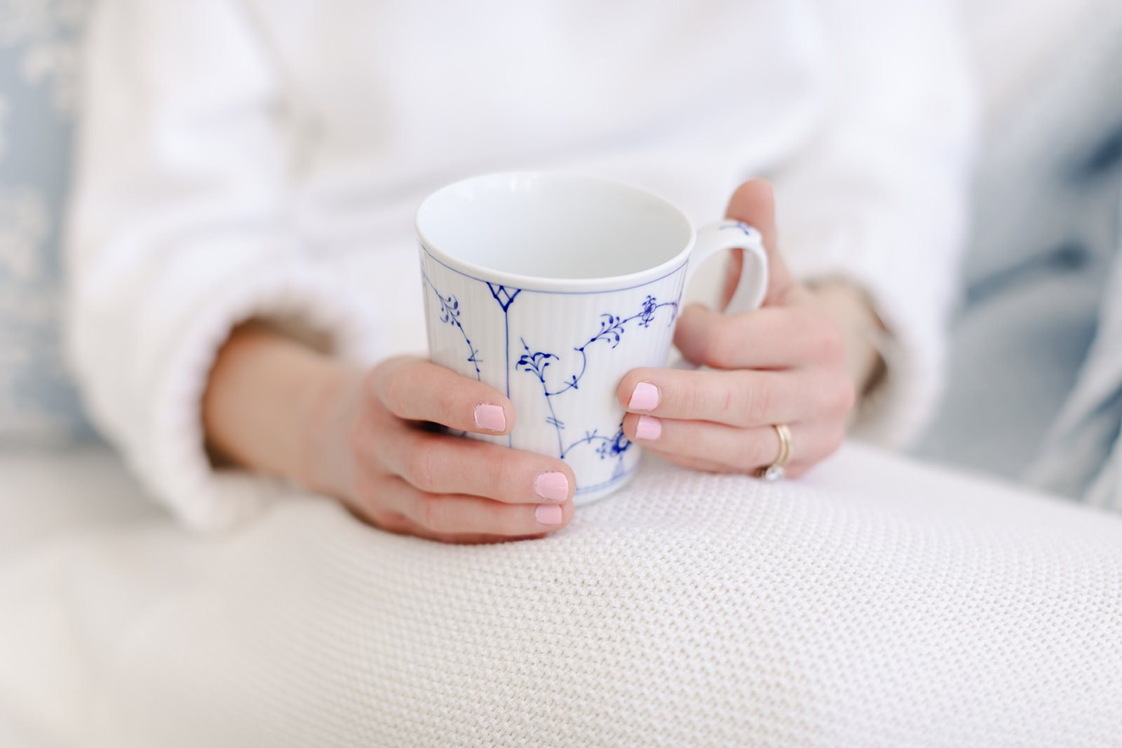 a mug being held by a woman