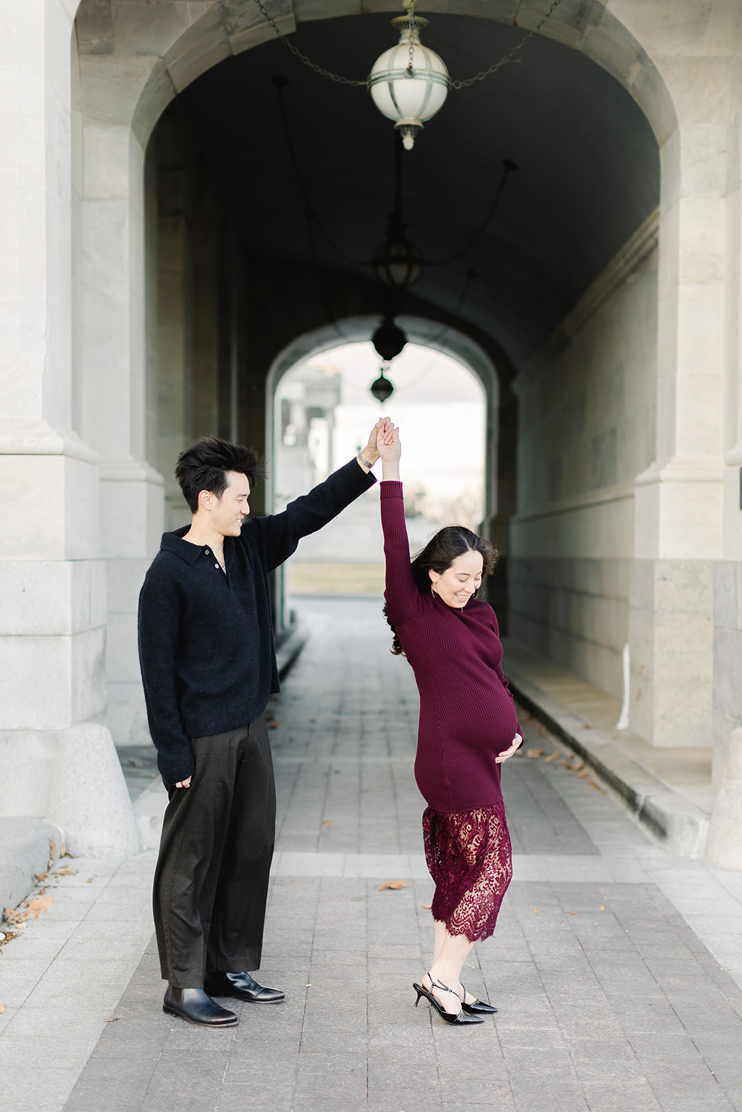 Couple expecting a baby dancing in front of the Capital building
