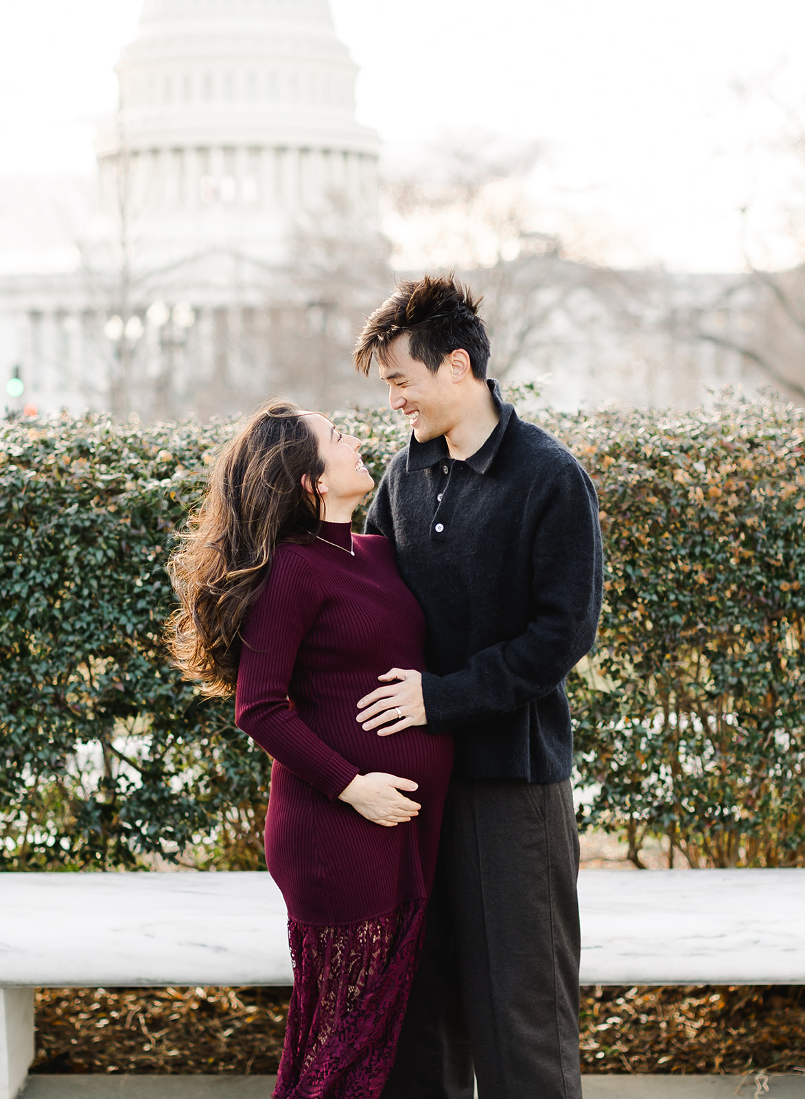 couple expecting a baby in front of the US capital