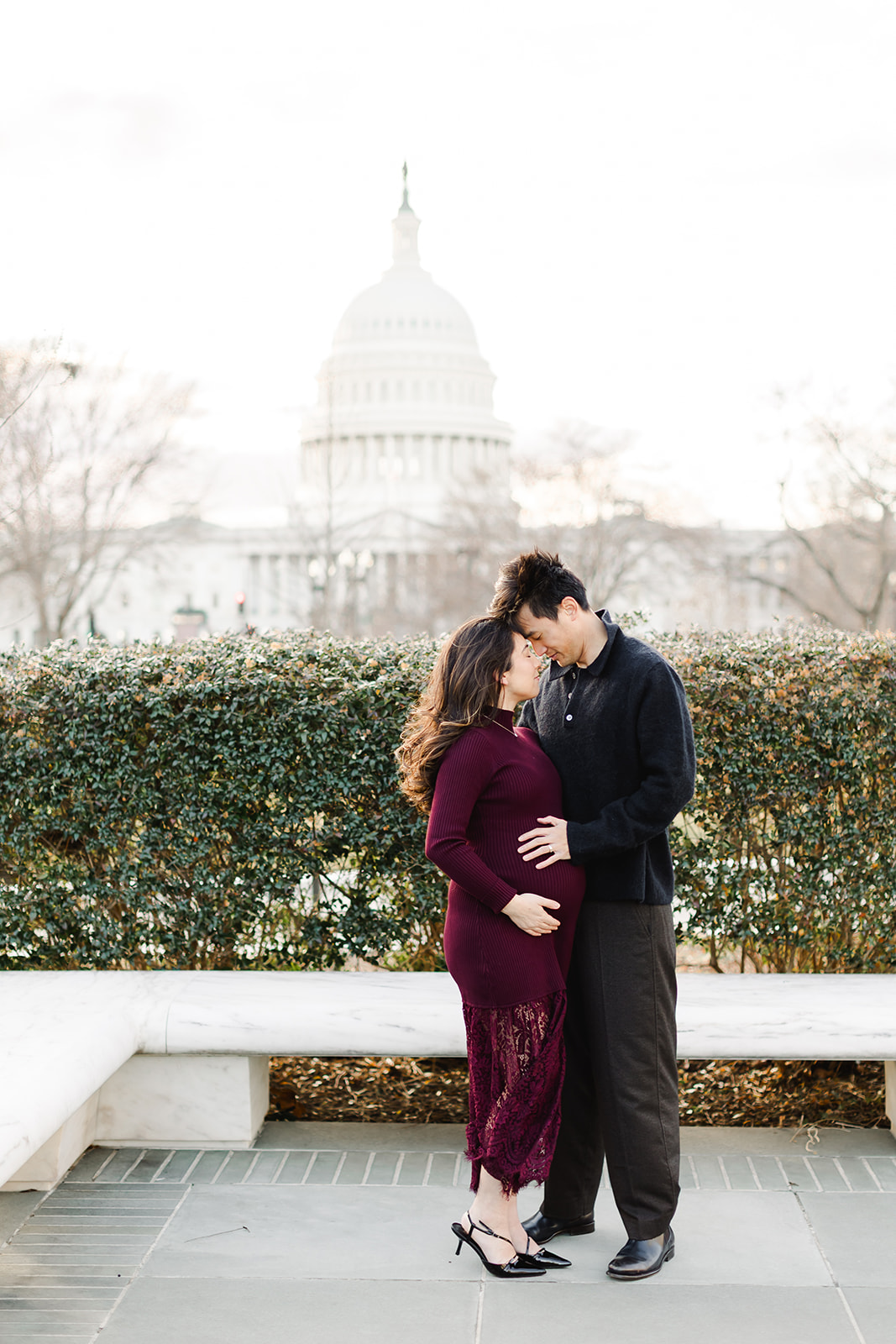 couple expecting a baby in front of the US capital