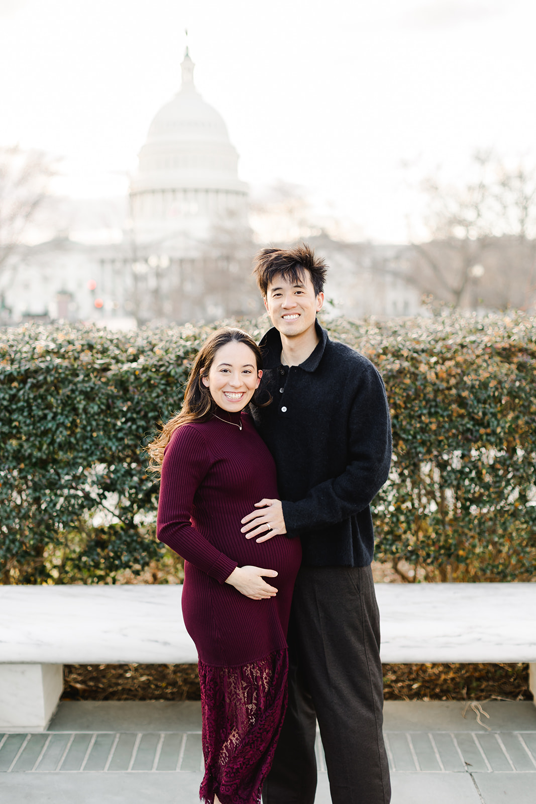 couple expecting a baby in front of the US capital